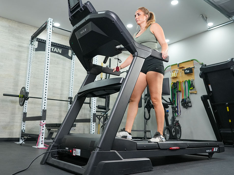 A woman on the Sole F63 at a slight incline