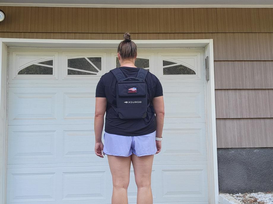 A woman wearing GORUCK Plate Carrier 3.0, one of the best weighted vests